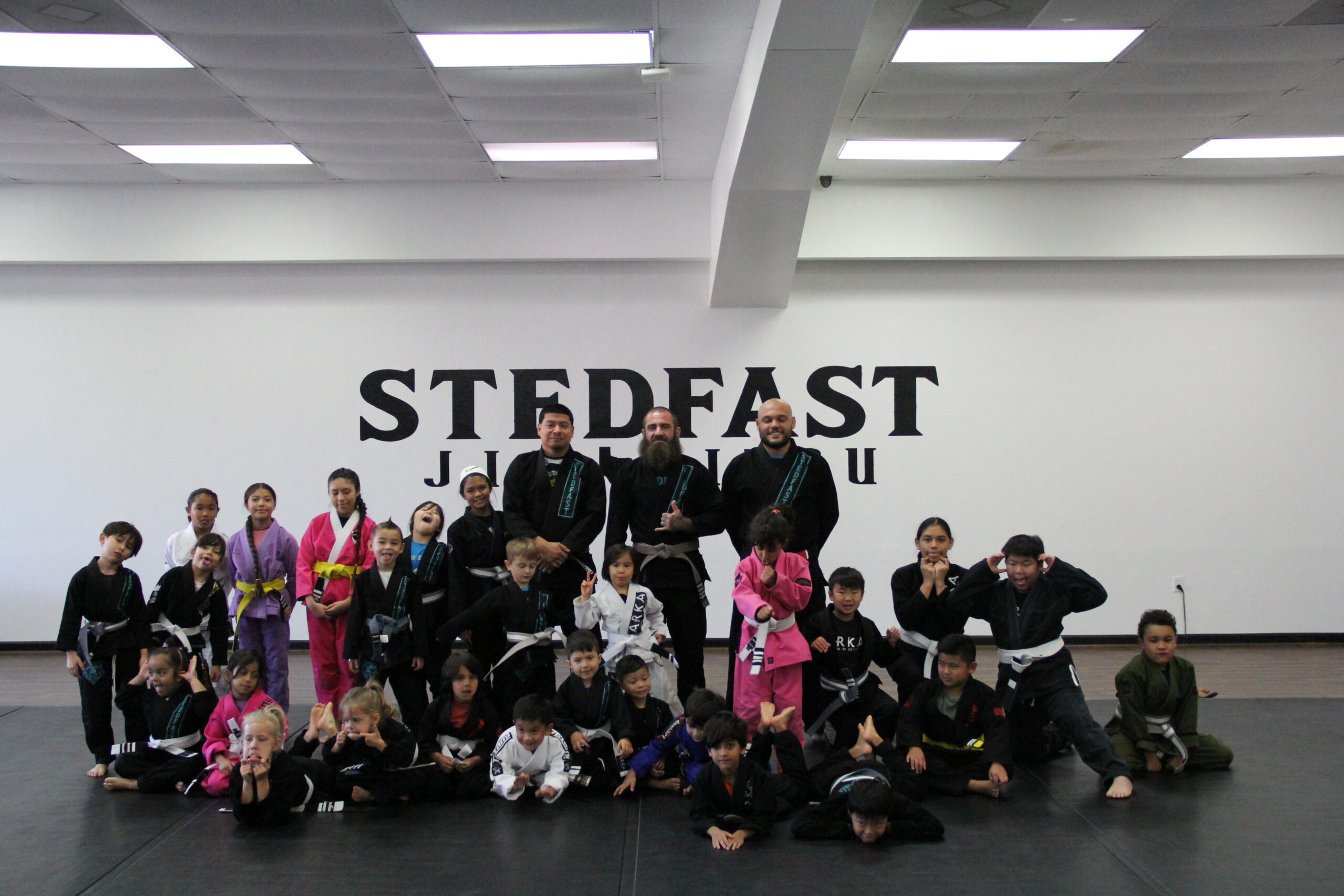 Kids jiu-jitsu Training: Children practicing jiu-jitsu techniques